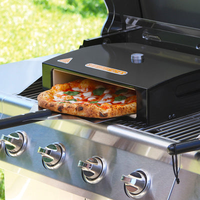A restaurant-quality tomato pizza is being done on Bakerstone's grill top pizza oven for the perfect outdoor grilled pizza experience.